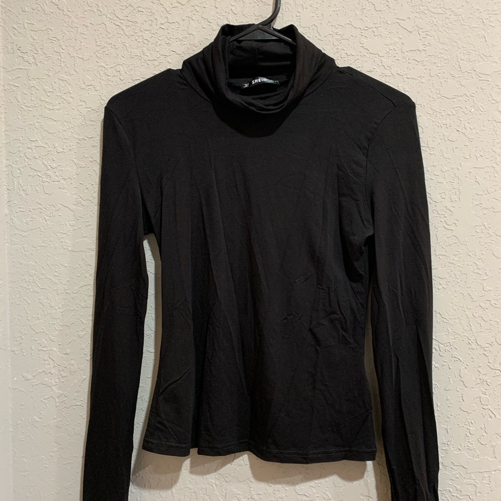 Tight black turtle neck